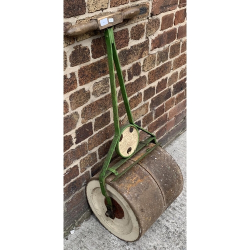 93 - An antique Ironcrete cast iron and wooden handled garden roller - approx. 102cm high