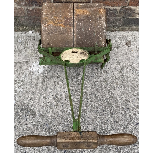 93 - An antique Ironcrete cast iron and wooden handled garden roller - approx. 102cm high