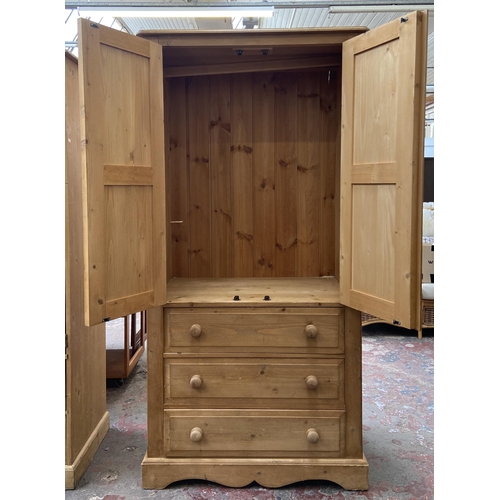 103 - A modern pine double wardrobe - approx. 183cm high x 91cm wide x 55cm deep