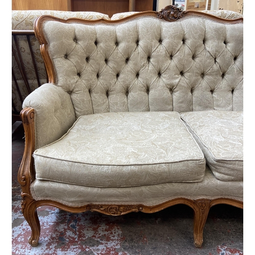 107 - A French Louis XV style carved beech and fabric upholstered two seater sofa - approx. 96cm high x 14... 