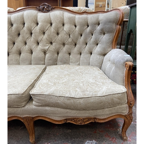 107 - A French Louis XV style carved beech and fabric upholstered two seater sofa - approx. 96cm high x 14... 