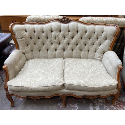 108 - A French Louis XV style carved beech and fabric upholstered two seater sofa - approx. 96cm high x 14... 