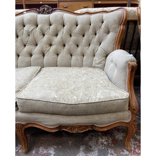 108 - A French Louis XV style carved beech and fabric upholstered two seater sofa - approx. 96cm high x 14... 