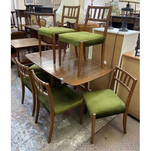 113 - A mid 20th century walnut and beech drop leaf gate leg dining table and six green fabric upholstered... 