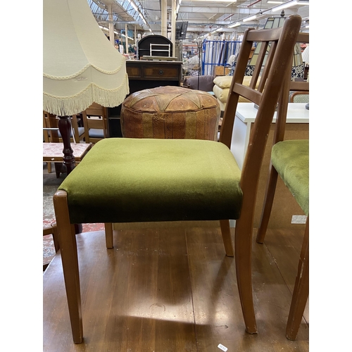 113 - A mid 20th century walnut and beech drop leaf gate leg dining table and six green fabric upholstered... 