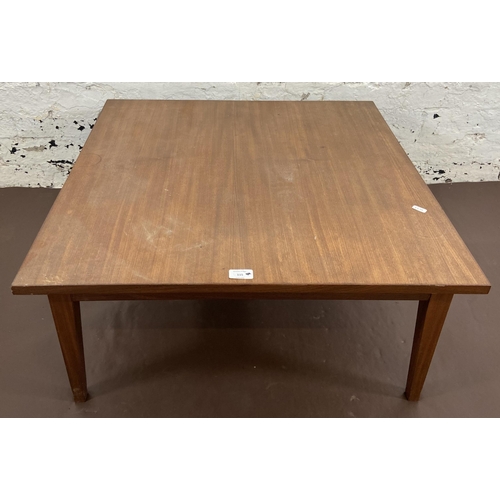 115 - A mid 20th century teak coffee table - approx. 34cm high x 74cm square