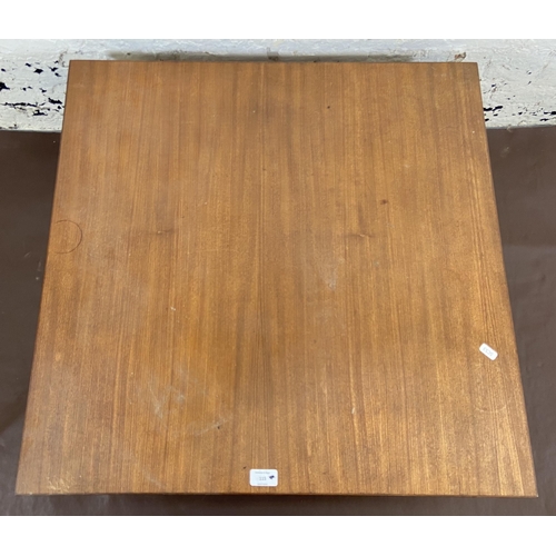 115 - A mid 20th century teak coffee table - approx. 34cm high x 74cm square