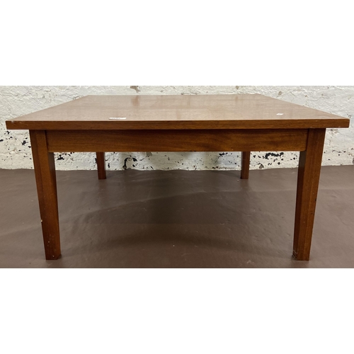 115A - A mid 20th century teak coffee table - approx. 36cm high x 74cm square