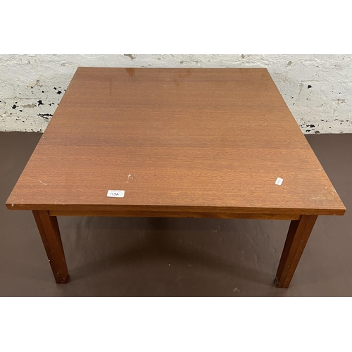 115A - A mid 20th century teak coffee table - approx. 36cm high x 74cm square