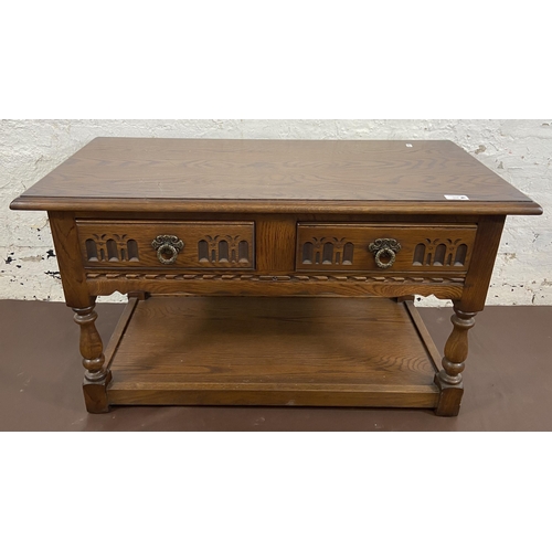 116 - An Old Charm carved oak two drawer coffee table - approx. 51cm high x 46cm wide x 91cm long