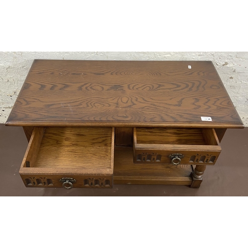 116 - An Old Charm carved oak two drawer coffee table - approx. 51cm high x 46cm wide x 91cm long