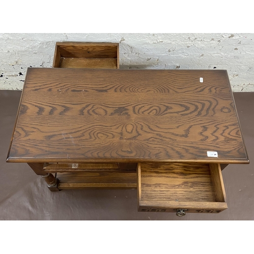 116 - An Old Charm carved oak two drawer coffee table - approx. 51cm high x 46cm wide x 91cm long