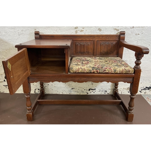 117 - Two pieces of Old Charm carved oak furniture, one telephone table - approx. 75cm high x 92cm wide x ... 