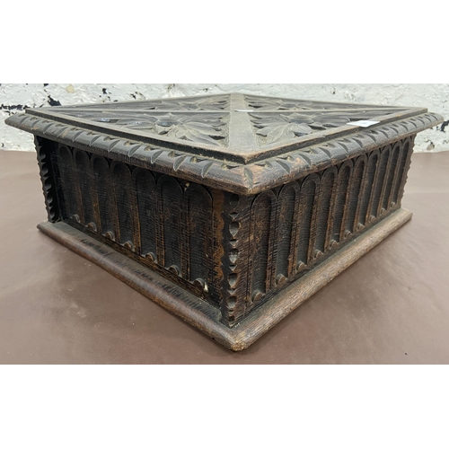 119 - A late 19th/early 20th century carved oak bible box - approx. 16cm high x 44cm wide x 38cm deep