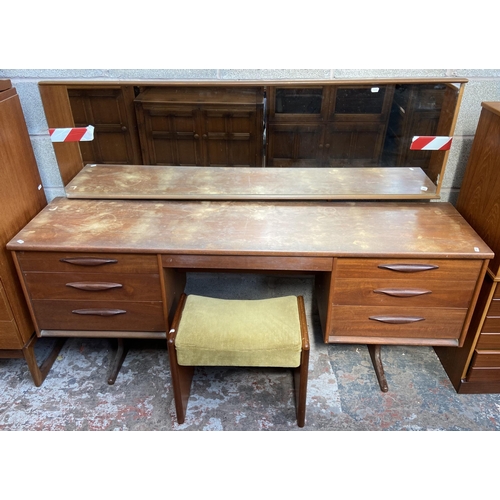 12 - A mid 20th century Austinsuite teak dressing table and stool - approx. 118cm high x 169cm wide x 42c... 