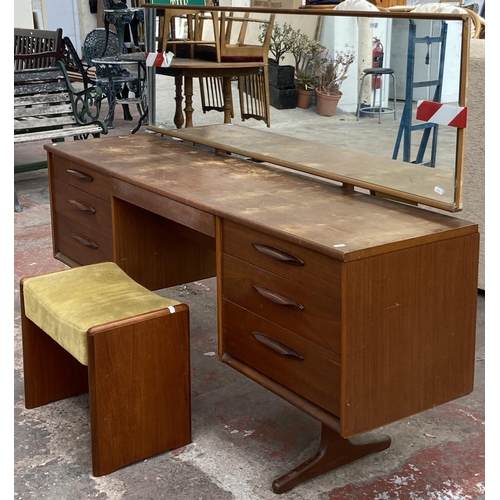 12 - A mid 20th century Austinsuite teak dressing table and stool - approx. 118cm high x 169cm wide x 42c... 