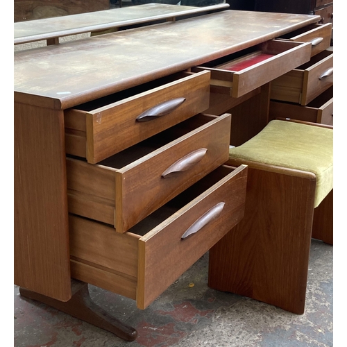 12 - A mid 20th century Austinsuite teak dressing table and stool - approx. 118cm high x 169cm wide x 42c... 