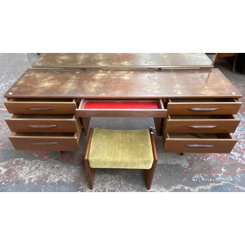 12 - A mid 20th century Austinsuite teak dressing table and stool - approx. 118cm high x 169cm wide x 42c... 