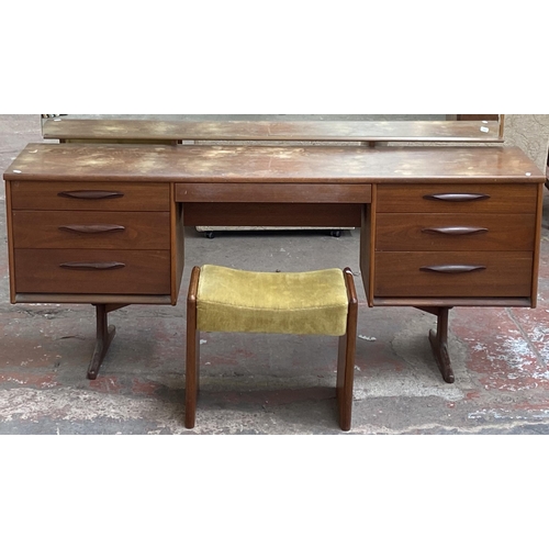 12 - A mid 20th century Austinsuite teak dressing table and stool - approx. 118cm high x 169cm wide x 42c... 