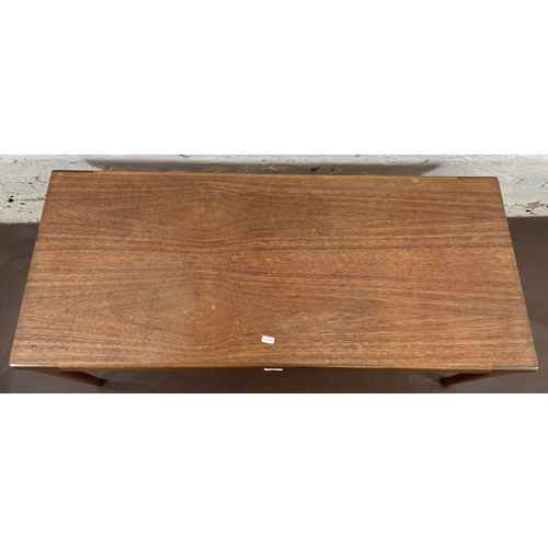 120 - A mid 20th century teak rectangular coffee table - approx. 42cm high x 46cm wide x 106cm long