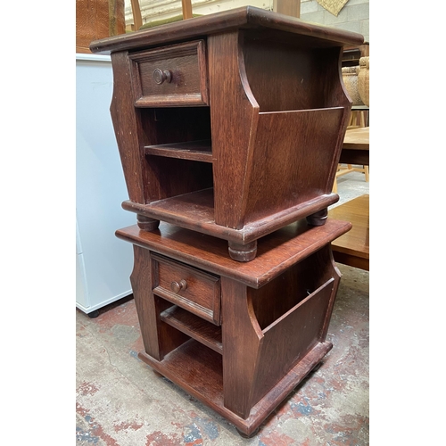 123 - A pair of stained oak magazine rack side tables - approx. 49cm high x 51cm wide x 46cm deep