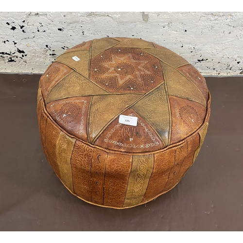 125 - A mid 20th century Moroccan leather circular footstool