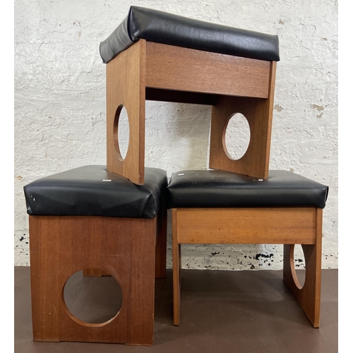 18 - Three mid 20th century teak and black vinyl dressing table stools - approx. 50cm high x 53cm wide x ... 