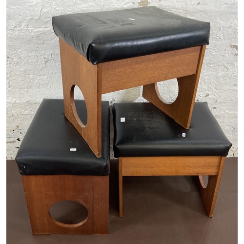 18 - Three mid 20th century teak and black vinyl dressing table stools - approx. 50cm high x 53cm wide x ... 