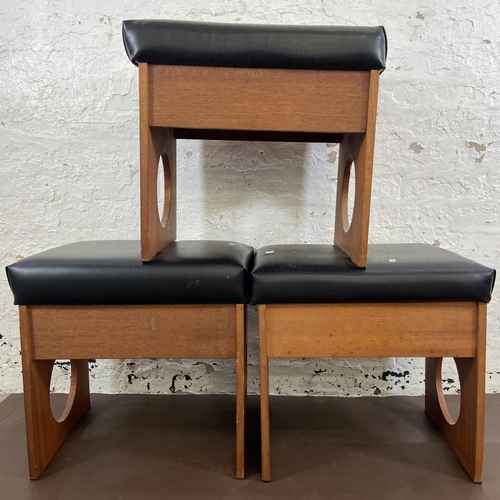 18 - Three mid 20th century teak and black vinyl dressing table stools - approx. 50cm high x 53cm wide x ... 