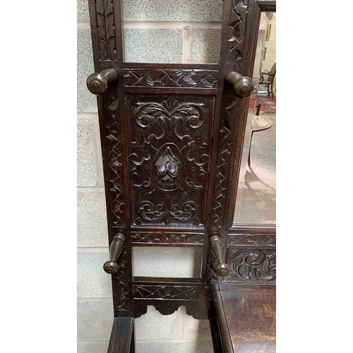 2 - A Victorian Gothic Revival carved oak hall stand with Green Man design and central bevelled edge mir... 