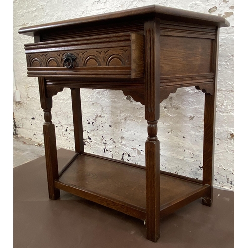 25 - A 17th century style carved oak console table - approx. 72cm high x 81cm wide x 37cm deep