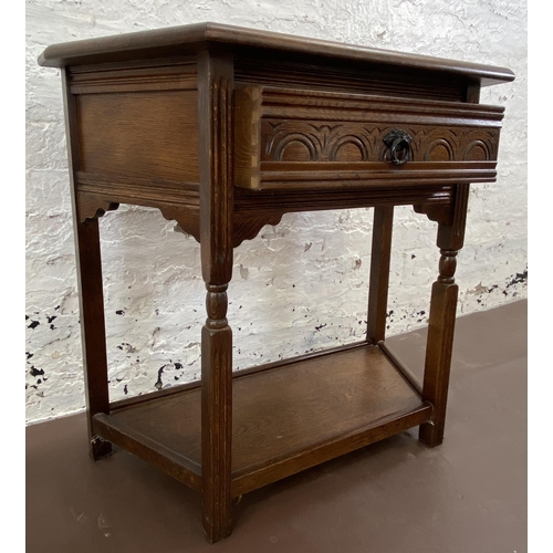 25 - A 17th century style carved oak console table - approx. 72cm high x 81cm wide x 37cm deep