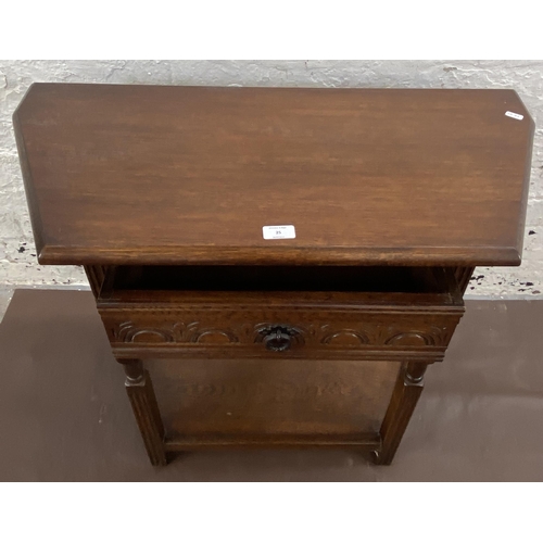 25 - A 17th century style carved oak console table - approx. 72cm high x 81cm wide x 37cm deep