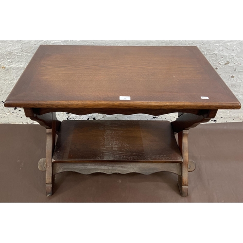 26 - An oak swivel top rectangular coffee table - approx. 61cm high x 50cm wide x 81cm long