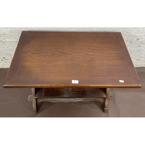 26 - An oak swivel top rectangular coffee table - approx. 61cm high x 50cm wide x 81cm long