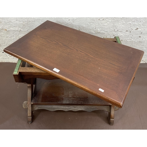 26 - An oak swivel top rectangular coffee table - approx. 61cm high x 50cm wide x 81cm long