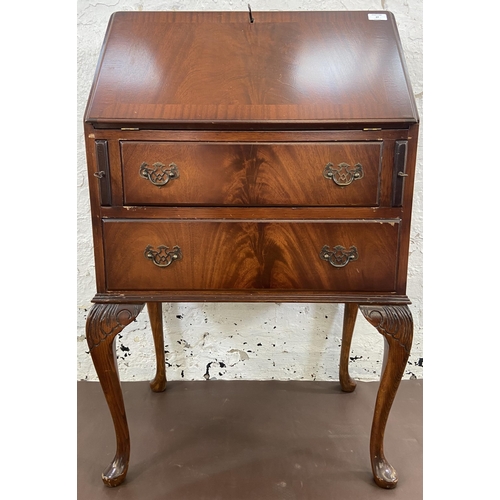 27 - A mahogany bureau on cabriole supports with fall front and green leather writing surface - approx. 1... 