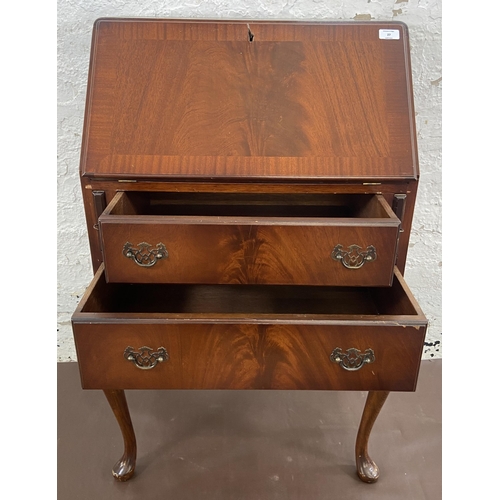 27 - A mahogany bureau on cabriole supports with fall front and green leather writing surface - approx. 1... 