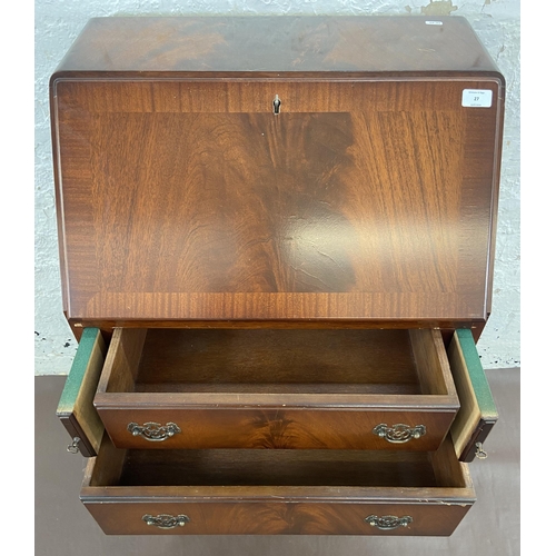 27 - A mahogany bureau on cabriole supports with fall front and green leather writing surface - approx. 1... 