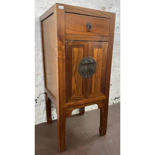 28 - A Chinese elm side cabinet with metal decoration - approx. 86cm high x 38cm wide x 38cm deep