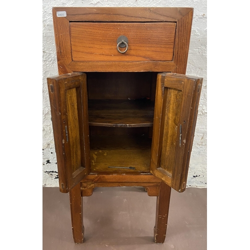 28 - A Chinese elm side cabinet with metal decoration - approx. 86cm high x 38cm wide x 38cm deep