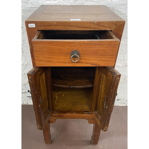 28 - A Chinese elm side cabinet with metal decoration - approx. 86cm high x 38cm wide x 38cm deep