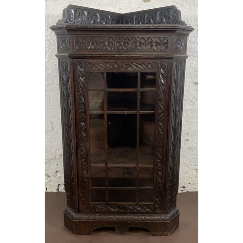 3 - A Victorian Gothic Revival carved oak corner display cabinet - approx. 117cm high x 67cm wide x 43cm... 