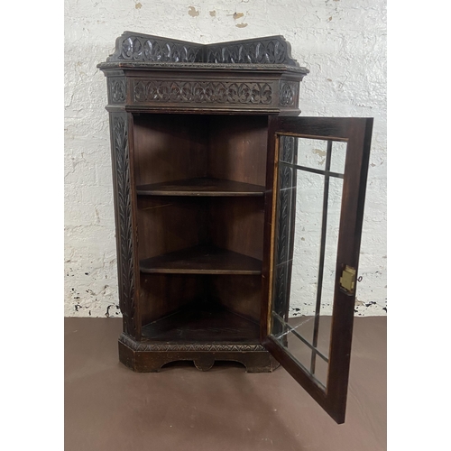 3 - A Victorian Gothic Revival carved oak corner display cabinet - approx. 117cm high x 67cm wide x 43cm... 