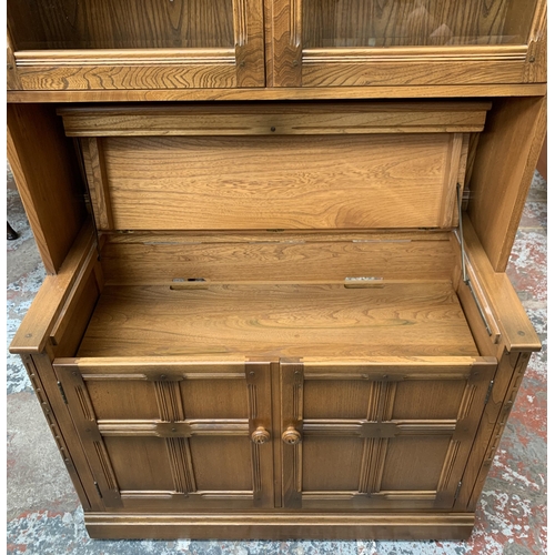 32 - An Ercol Golden Dawn elm display cabinet - approx. 197cm high x 97cm wide x 50cm deep