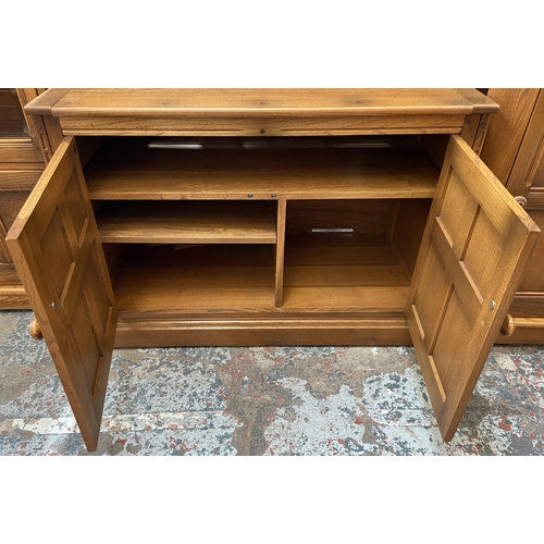 32 - An Ercol Golden Dawn elm display cabinet - approx. 197cm high x 97cm wide x 50cm deep