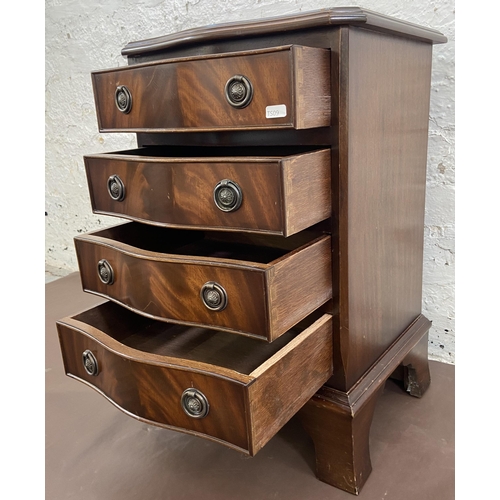 35 - A Regency style mahogany serpentine miniature chest of drawers on bracket supports - approx. 61cm hi... 