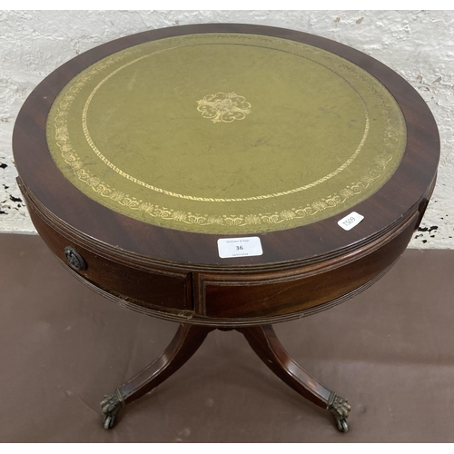 36 - A Regency style mahogany and green leather drum table - approx. 59.5cm high x 50cm diameter