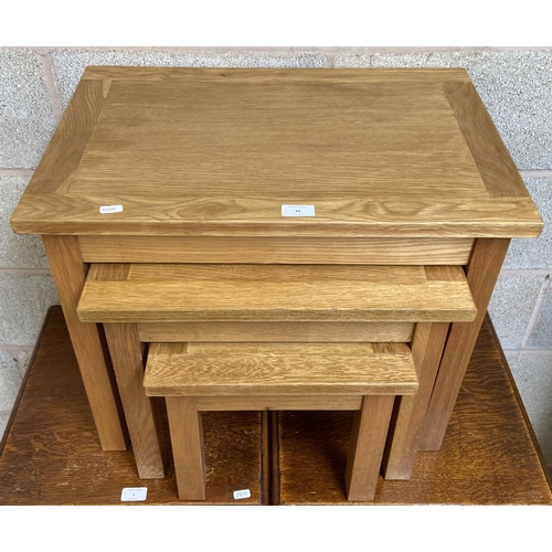 39 - A modern solid oak nest of three tables - approx. 50cm high x 60cm wide x 40cm deep