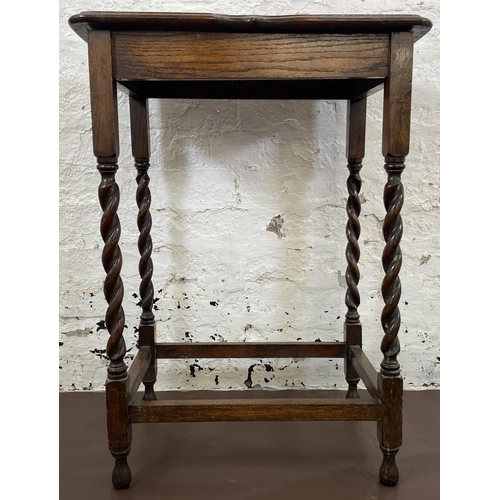 42 - An early 20th century oak serpentine top barley twist side table - approx. 77cm high x 39cm wide x 5... 